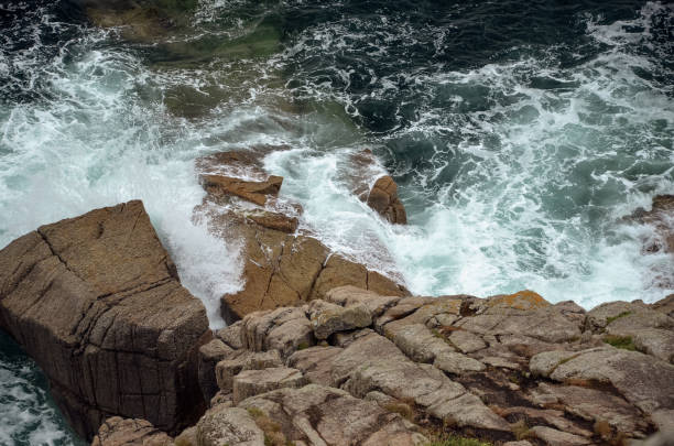 istock Rocky coast in Cornwall with rough cliffs in the water 2158573324