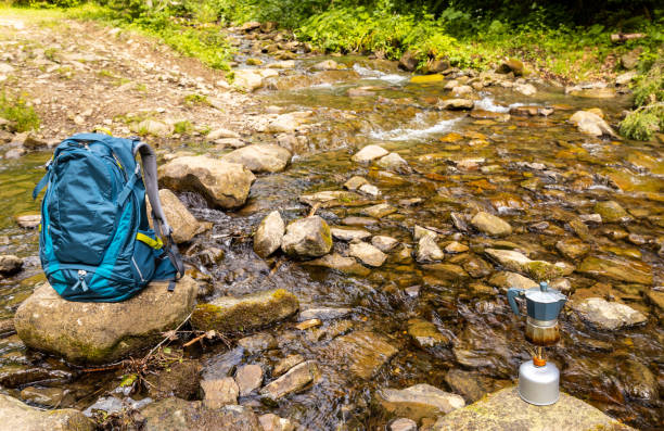 istock Hiking in the mountains with a backpack and a tent in summer. 2158573515