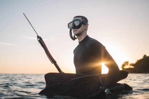 istock Young spearfisherman in water 2158573809