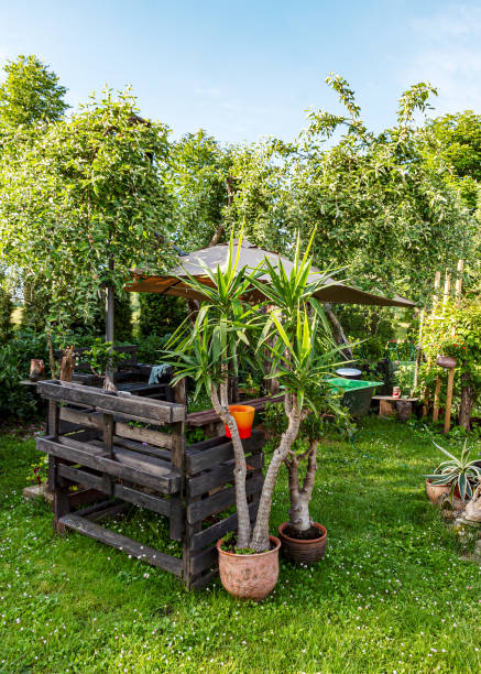 istock landscape with garden in summer, decorative objects, garden lighting, small garden in summer, summer 2158575971