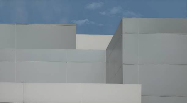 istock Minimalistic architectural design of a modern building with a clear blue sky background 2158576041