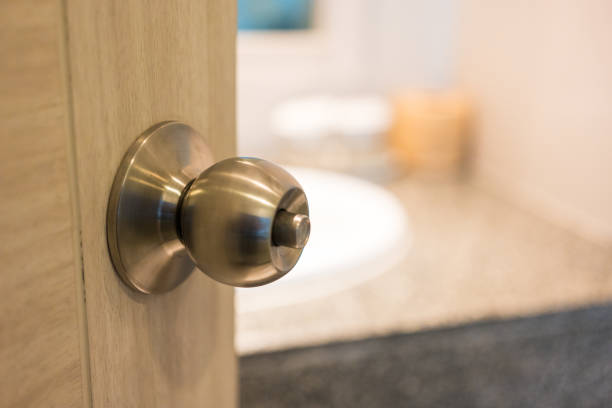 istock Door handle on open door in bathroom 2158576643