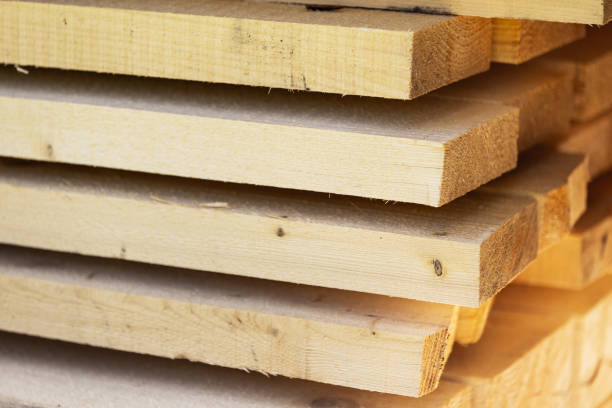 istock Stacked pine wood close up photo with selective focus 2158576675