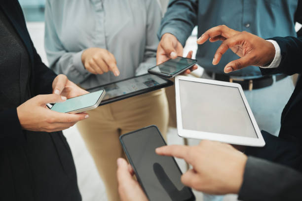istock Business people, hands and networking on mockup screen for data sharing, collaboration or app at office. Hand of group working on technology in social media communication with display for marketing 2158576906