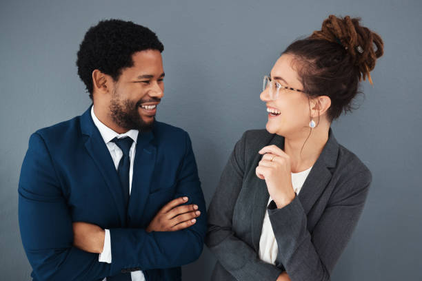 istock Partnership, friends and networking with business people laughing for teamwork, support and communication. Happy, funny and diversity with black man and woman for conversation, corporate and social 2158576940