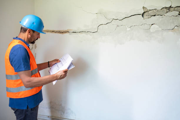 istock Real estate property appraisal engineer studying the blueprints. 2158577936