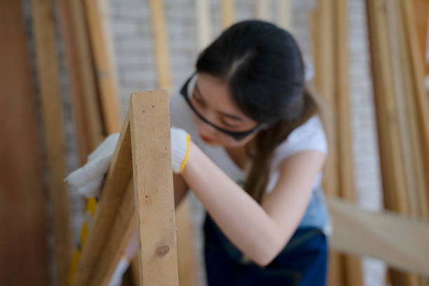 Carpenter is working at woodshop. Small business and handcraft.