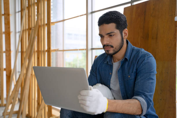 istock Carpenter is working at woodshop. 2158579619