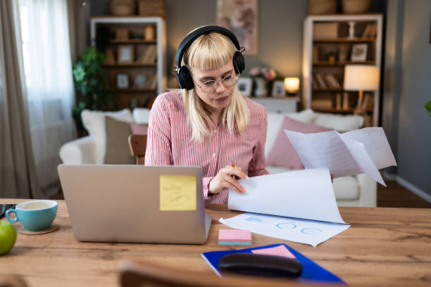 istock Young introvert freelancer businesswoman with ADHD working remotely from home office on laptop computer. Business person avoiding crowded office and people by working alone at apartment on computer. 2158580300