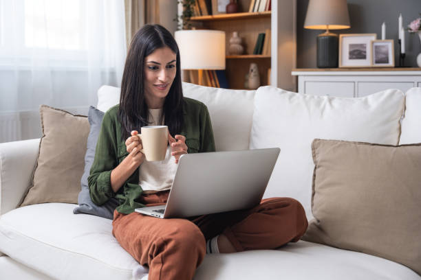 istock Young introvert freelancer businesswoman with ADHD working remotely from home office on laptop computer. Business person avoiding crowded office and people by working alone at apartment on computer. 2158580332