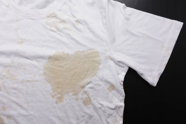 istock spilled coffee on a white shirt 2158584014