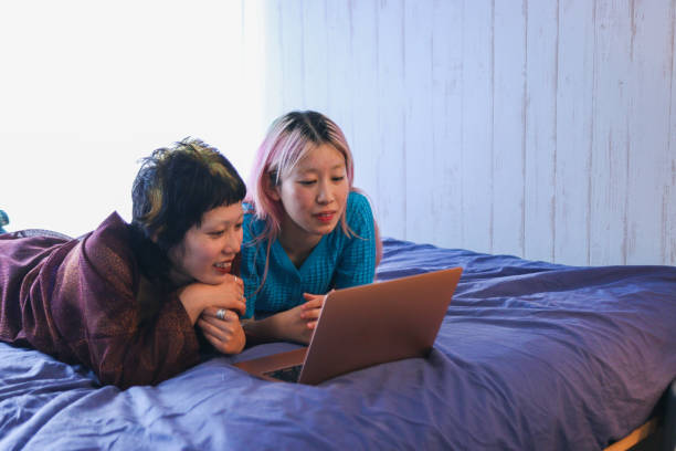 istock Young people using a laptop to buy tickets online 2158587457