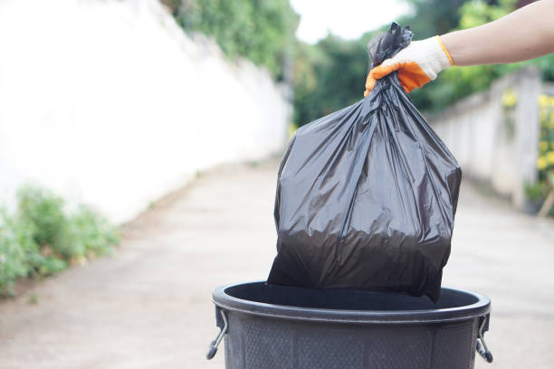 istock Hand holding garbage black bag putting in to the bin. Concept, garbage management, Keep clean for sanitary and community service for the best environment. Zero waste. 2158587930