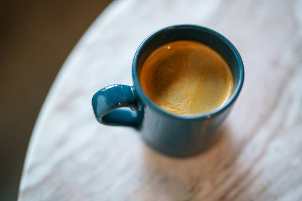 High angle view a cup of black coffee on a marble table