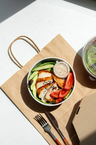 istock Take out poke bowl with craft bag on white background 2158595334