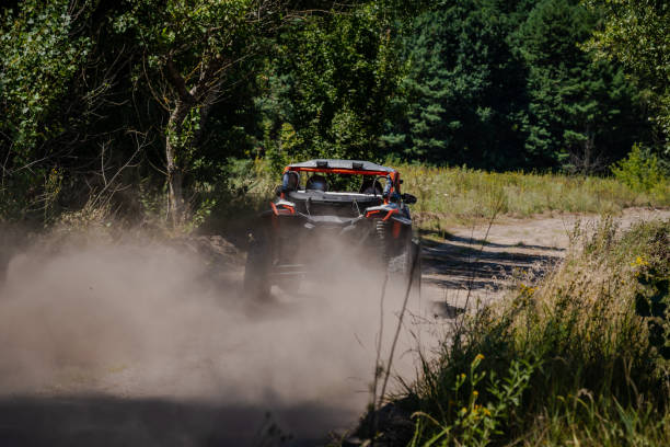 istock Outdoor activities UTV buggy moves on dusty road. 4x4, extreme, adrenalin. 2158596091
