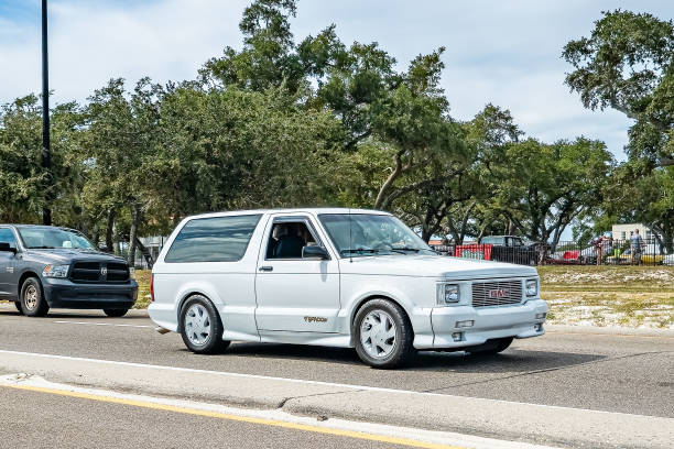 1993 GMC Typhoon SUV Gulfport, MS - October 07, 2023: Wide angle front corner view of a 1993 GMC Typhoon SUV at a local car show. gmc typhoon stock pictures, royalty-free photos & images