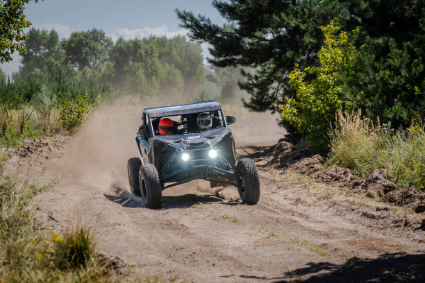 istock Cool view on hard ride UTV on sandy track. 4x4, extreme, adrenalin. 2158596149