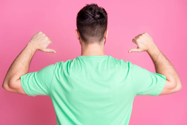 istock Rear view photo of perky optimistic cool guy with beard dressed green t-shirt indicating at himself isolated on pink color background 2158596805