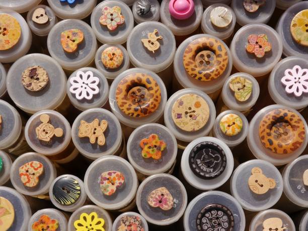 Collection of Colorful and decorative buttons in plastic containers