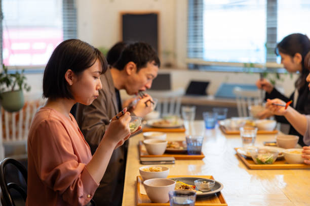 istock Freelance worker having lunch in cafe / co-working space 2158601783