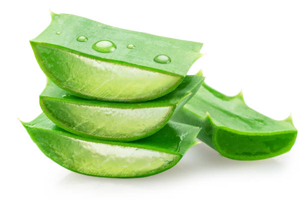 Fresh cuts of aloe vera leaf are arranged in pyramid, macro shot isolated on white background. File contains clipping path.