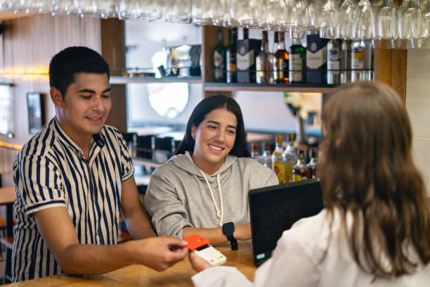 istock Man paying with credit card in restaurant. 2158608210