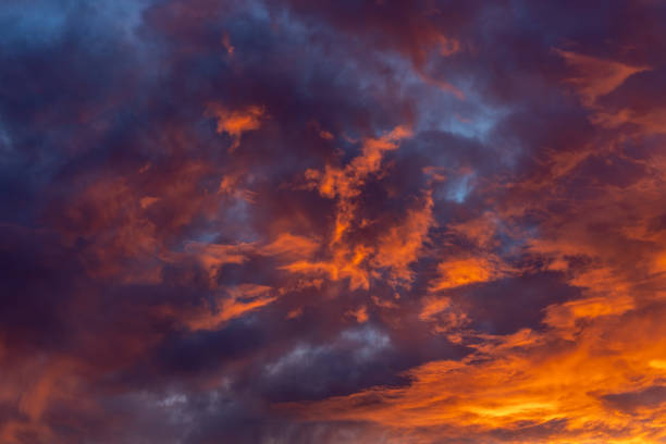 istock Dramatic fiery bloody sky with fluffy clouds at sunset 2158608249