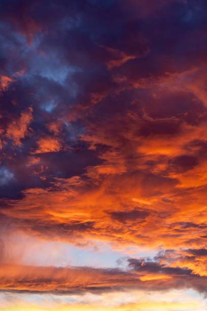 istock Dramatic fiery sky with dark red fluffy clouds in evening or morning 2158608255