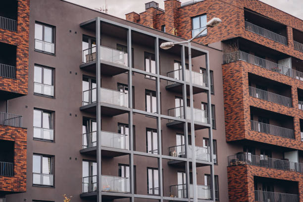 istock Residential building or hotel facade with brick frames on balcony 2158611314