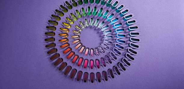 istock Dynamic spiral paper cut design with a vibrant rainbow gradient, set against a rich purple background. 2158613432