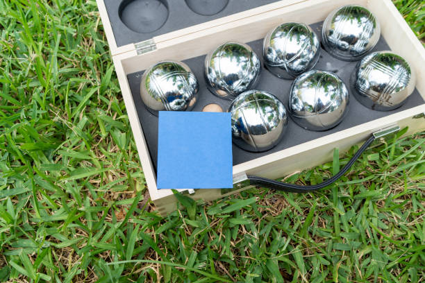The game balls are on the grass, and there is a blue note