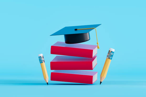 istock Graduation cap on flying stacked books, back to school concept 2158615855