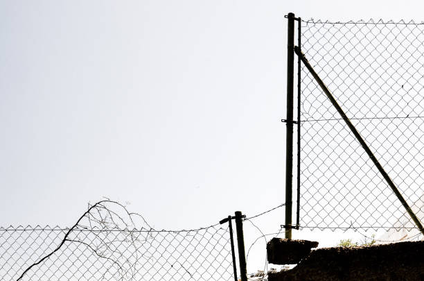 abstract silhouette view of a broken fence
