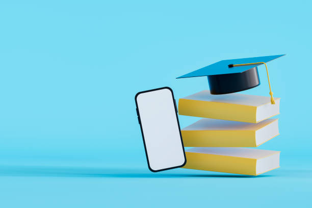 istock Graduation cap on flying stacked books with blank screen smart phone, back to school concept 2158617594