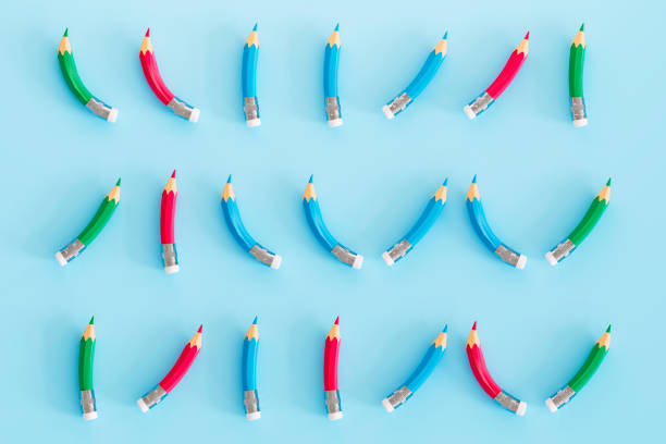 Group of Curved Pencils on Blue Background, Back to School, Minimal Idea Background. Digitally generated image. 3d render.