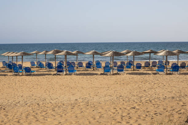 istock Vacant Beach with Rows of Chairs 2158627056