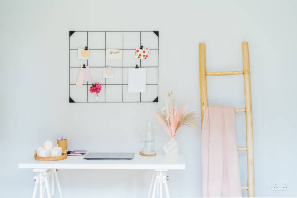 istock Home office workplace design. White desk with open laptop mockup, grid mood board with peach and pink colors palette and cozy feminine decor, like candles, dried flowers. Inspiration and mood concept. 2158627173