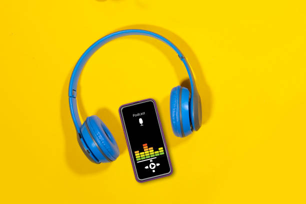 istock Podcast background. Mobile smartphone screen with podcast application, hands women sound headphones 2158629300