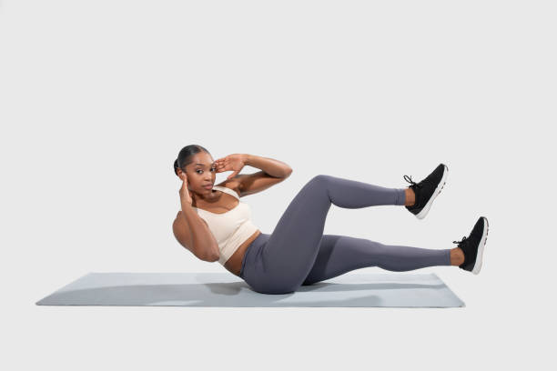 istock Woman Performing Exercise on Mat Over White Background 2158629772