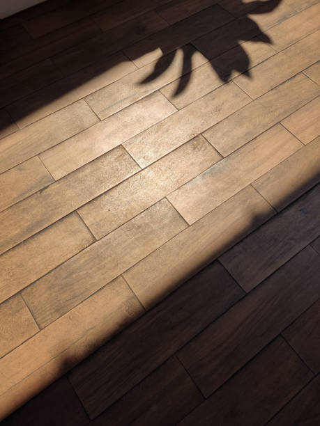 istock Wooden textured vinyl floor architecture design with dark shadow 2158638028