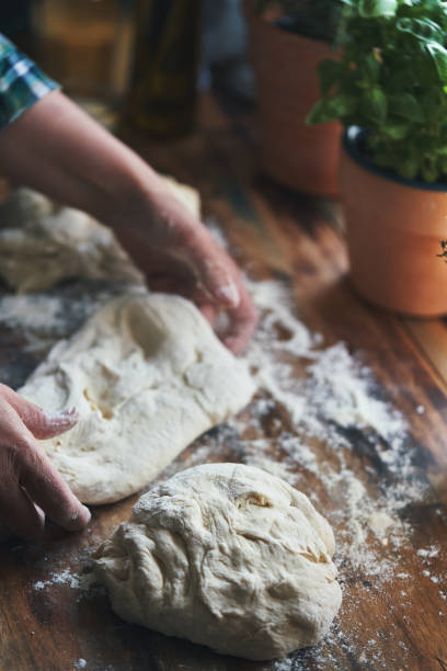 istock Preparing Focaccia Bread in Domestic Kitchen 2158640671