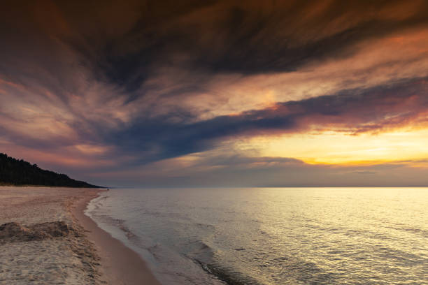 Picturesque view of the beach against the sky during sunset over the Baltic Sea, Poland