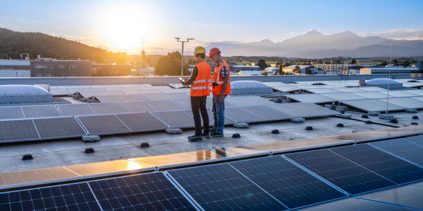 istock Senior and Adult Caucasian Engineers Evaluating Solar Panels 2158645860