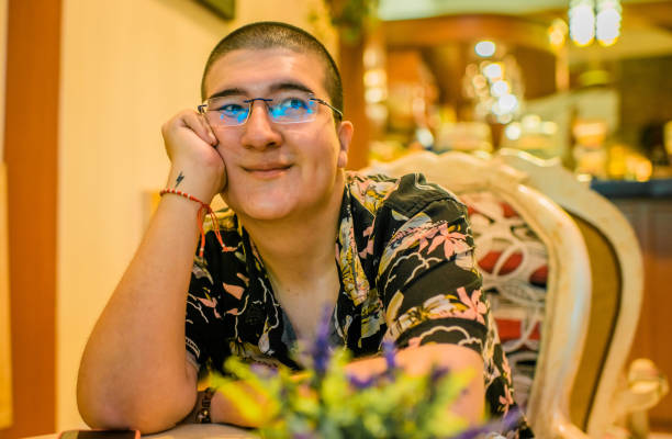 istock latin man sitting in a coffee shop 2158650936