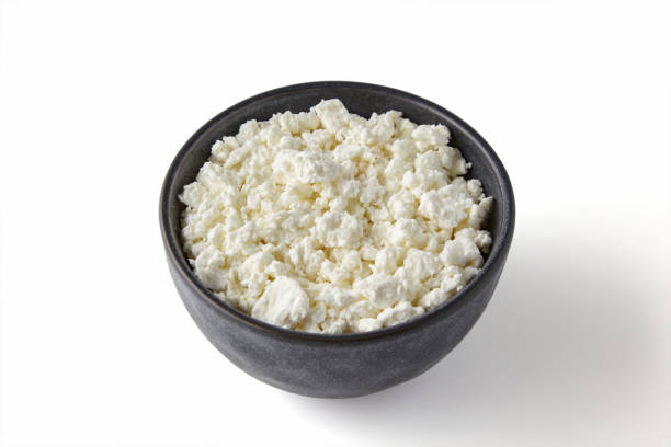 istock Cottage cheese in a ceramic bowl isolated on a white background. High angle view 2158652342