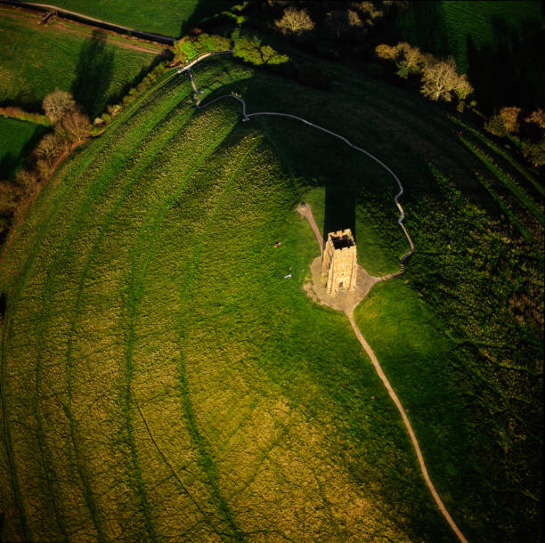 St Michael's Tower built  in the 14th century on top of Glastonbury Tor in Somerset eclipses the Full Moon800mm lens from half a mile distance to give this perspective.