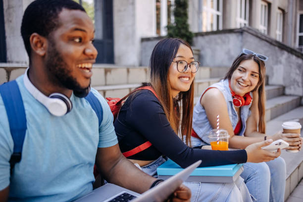 istock Multiracial group of students in front of University after class 2158653937