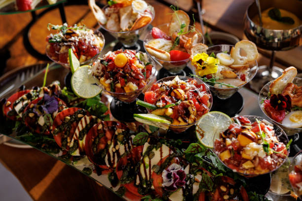 istock Luxury catering seafood snacks with shrimp, ceviche, and lime slices drizzled with balsamic glaze 2158656201