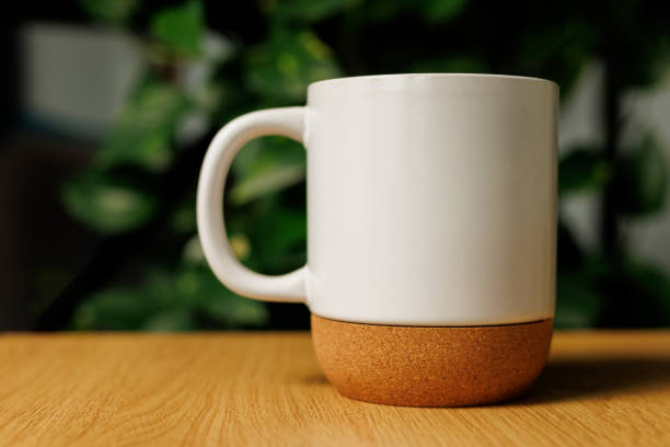 istock White glass eco cup with wooden elements on the table. 2158656237